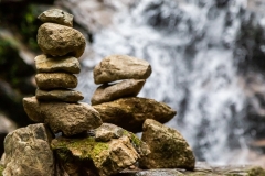Cairns at a waterfall in Colombia.