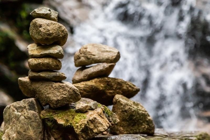 Cairns at a waterfall in Colombia.