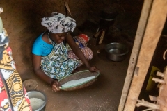 Young Girl Sifting Rice