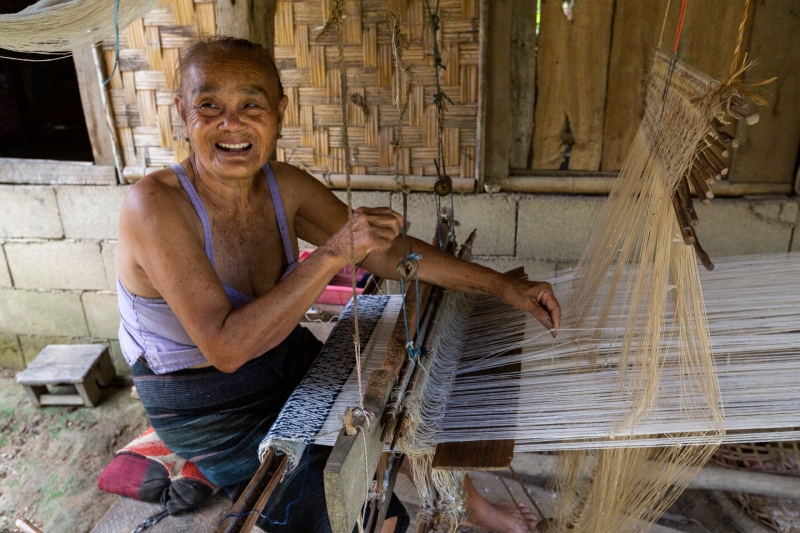 Lady Weaving Bookbags in Laos