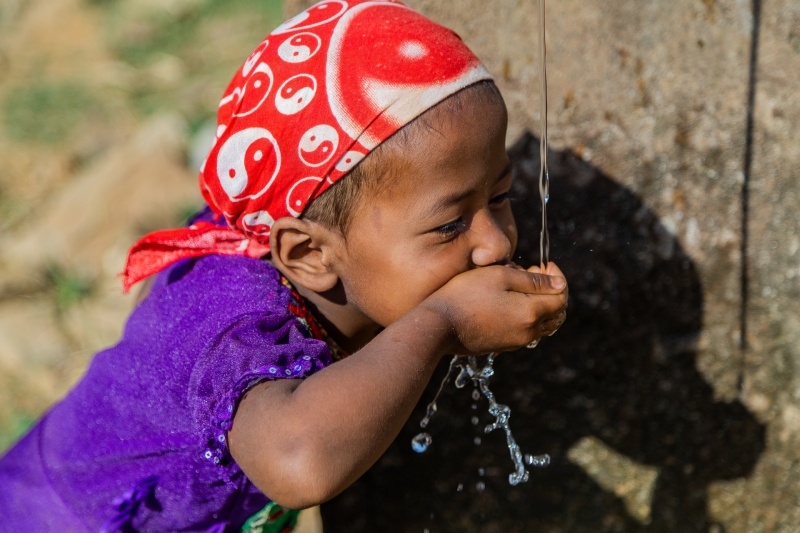 Young Girl Drinking Water