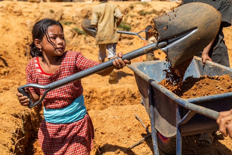 Nepalese Girl Helping Shovel